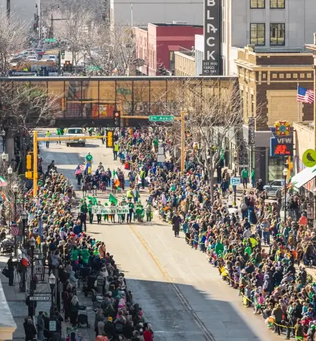 a large crowd of people in a parade